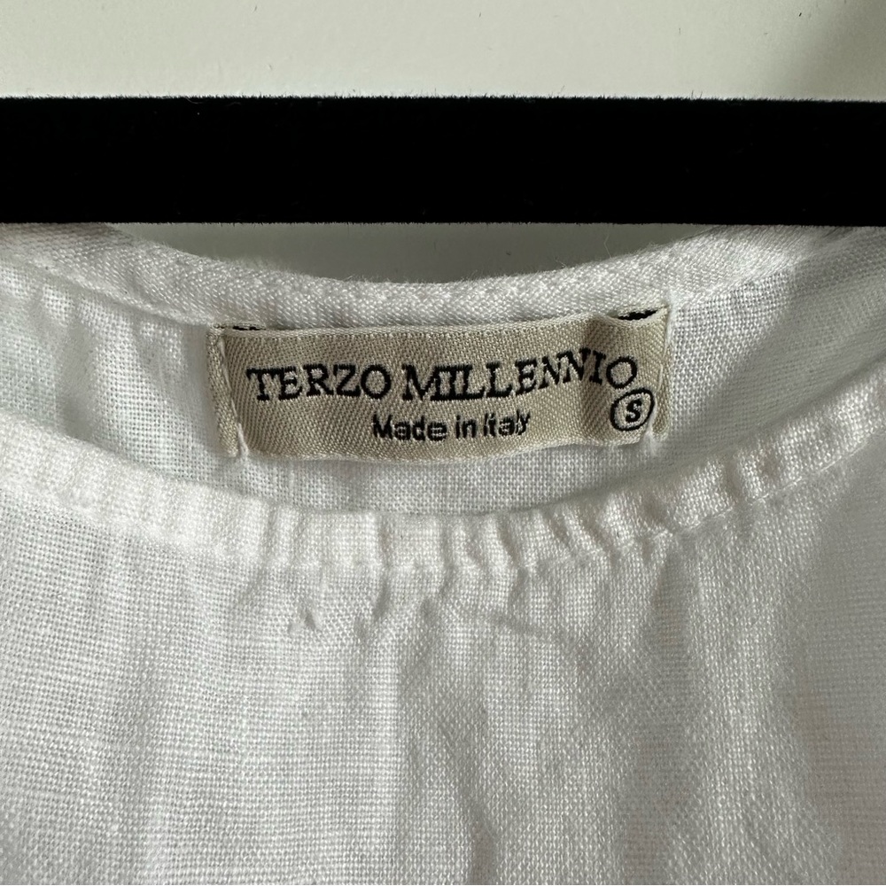 Italian Linen white top with drop back and pearl button accents.